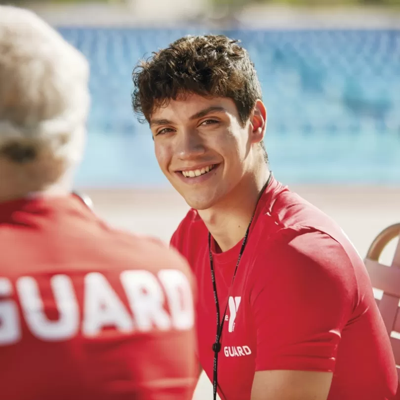 Lifeguards talking and smiling