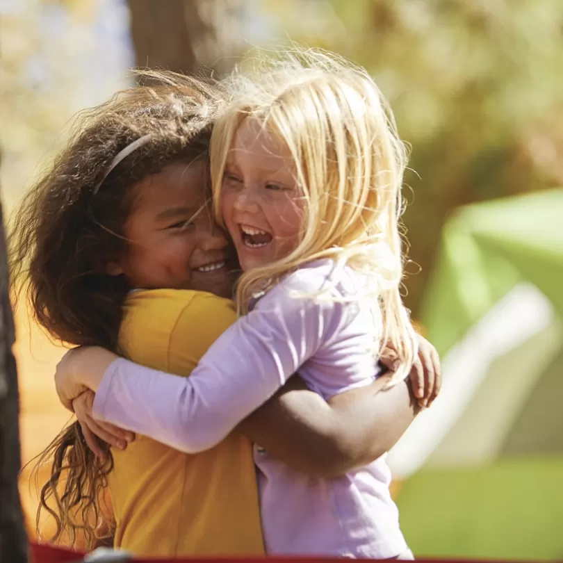 YMCA kids hugging