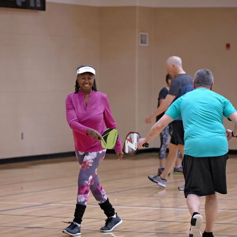 Pickleball team celebrate after a good shot