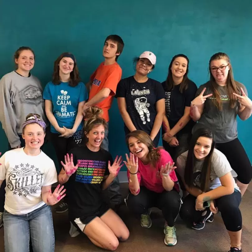 Teen volunteers make funny faces for the camera