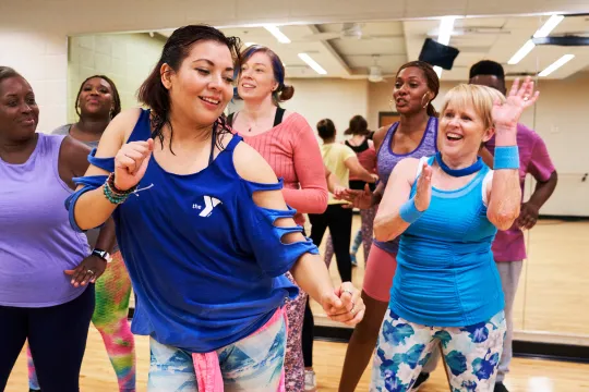 A YMCA dance instructor teaches a dance class.