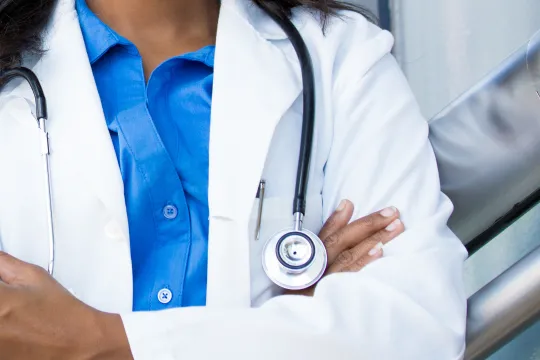 An abstract close up picture of a female doctor.