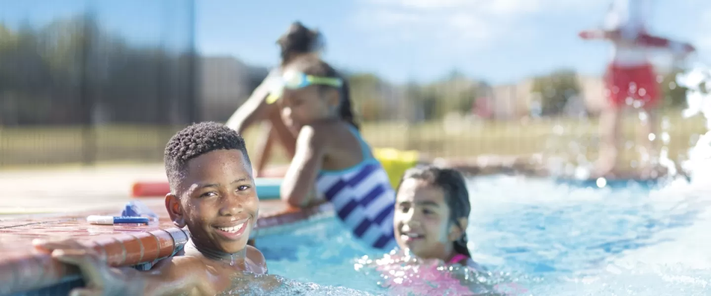 kids in outdoor pool