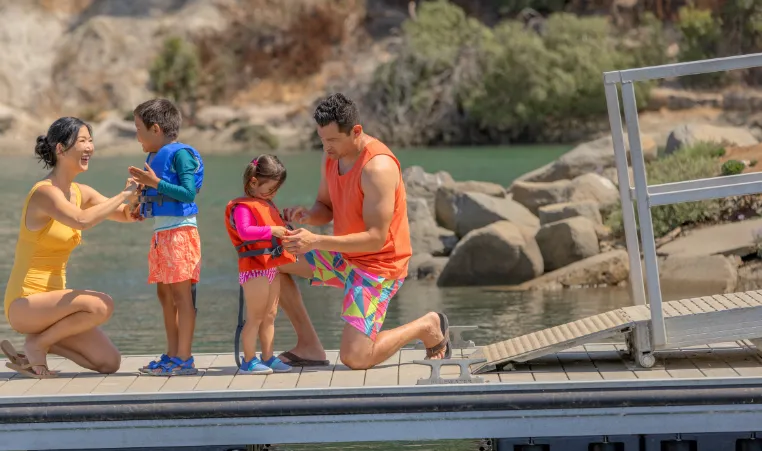 A family by a lake.