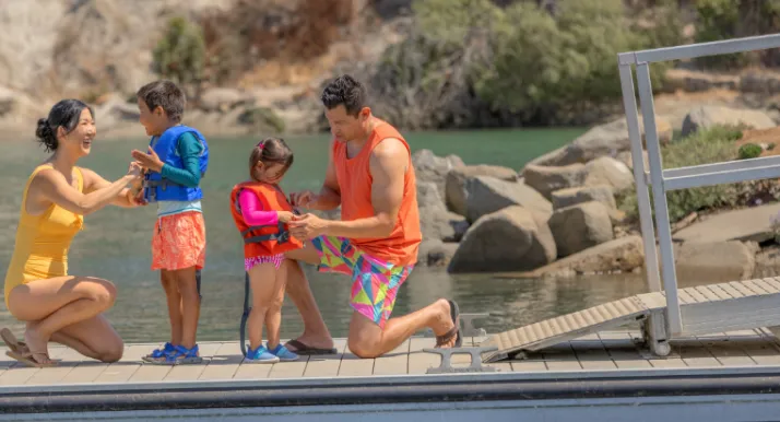 A family by a lake.