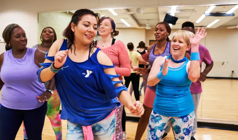 A YMCA dance instructor teaches a dance class.